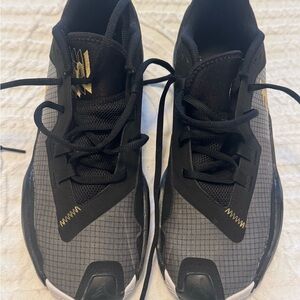 Jordan Black and Gray Athletic Shoes with Gold Accents